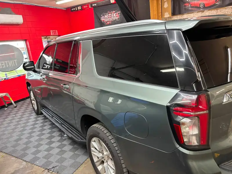 Chevrolet Suburban with ceramic tint under the HITEK American Tinter banner