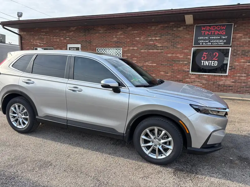 Silver Honda CR-V with window tint outside 502 Tinted, 5410 Valley Station Rd, Louisville