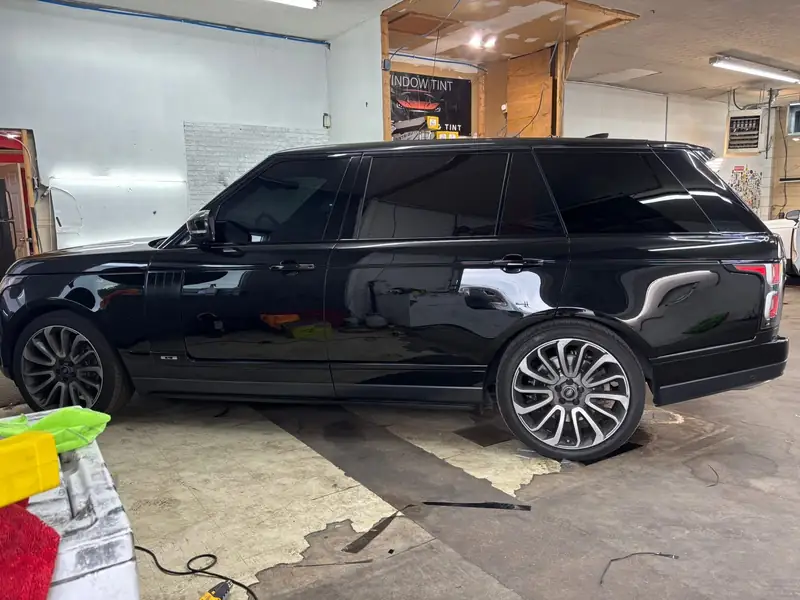Black Range Rover with ceramic window tint inside the 502 Tinted shop