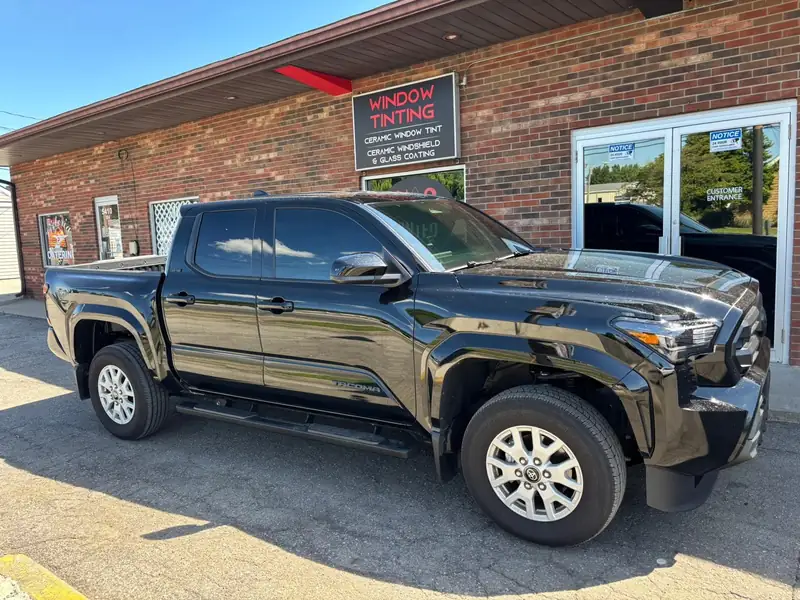 Black Toyota Tacoma with HITEK ceramic tint outside 502 Tinted on Valley Station Road