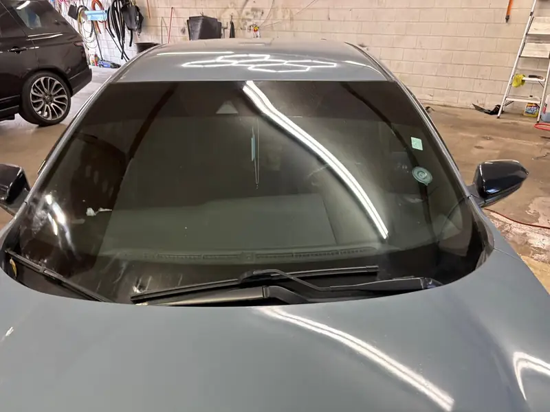 Windshield film installed on a car in the 502 Tinted bay